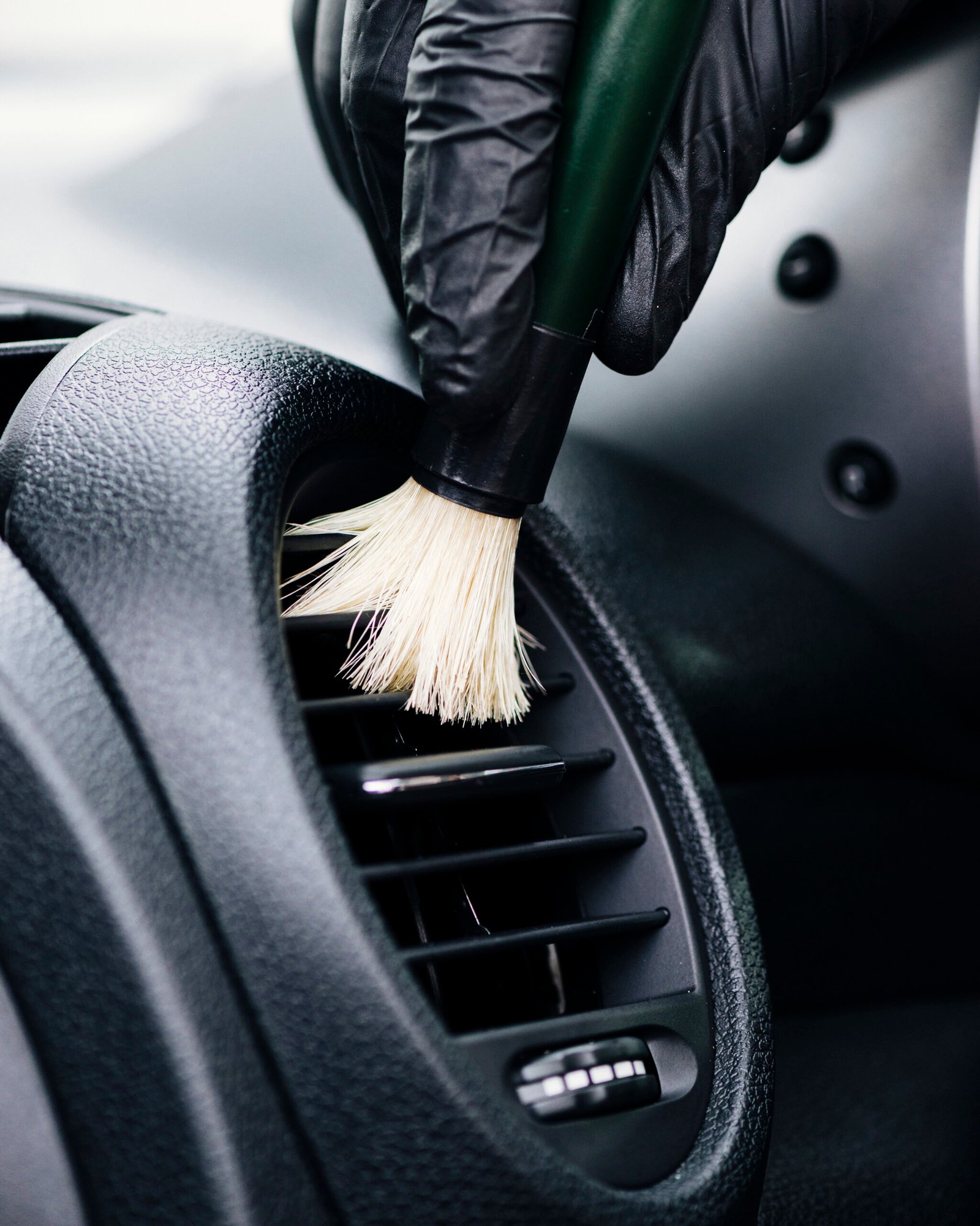 close-up-person-cleaning-car-interior